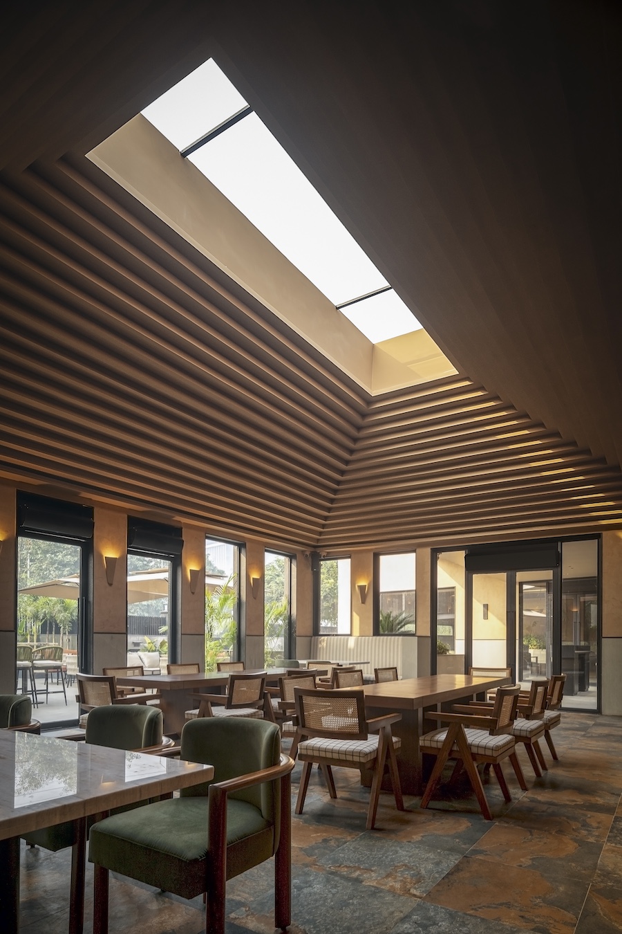 camo restaurant and bar noida india the geometric forms angular architecture earthy materials two zones pyramidical skylight roof