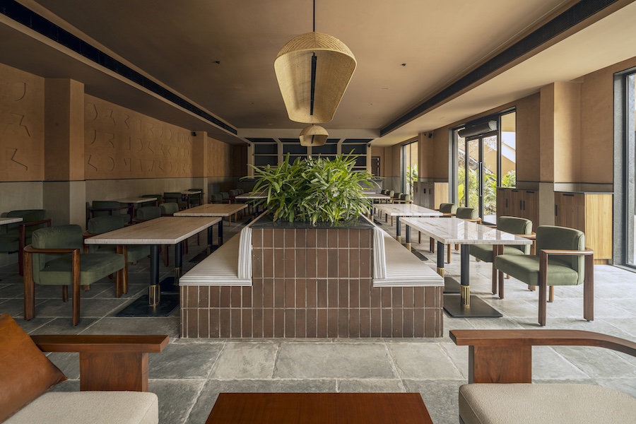 camo restaurant and bar noida india the geometric forms angular architecture earthy materials two zones terracotta green chairs
