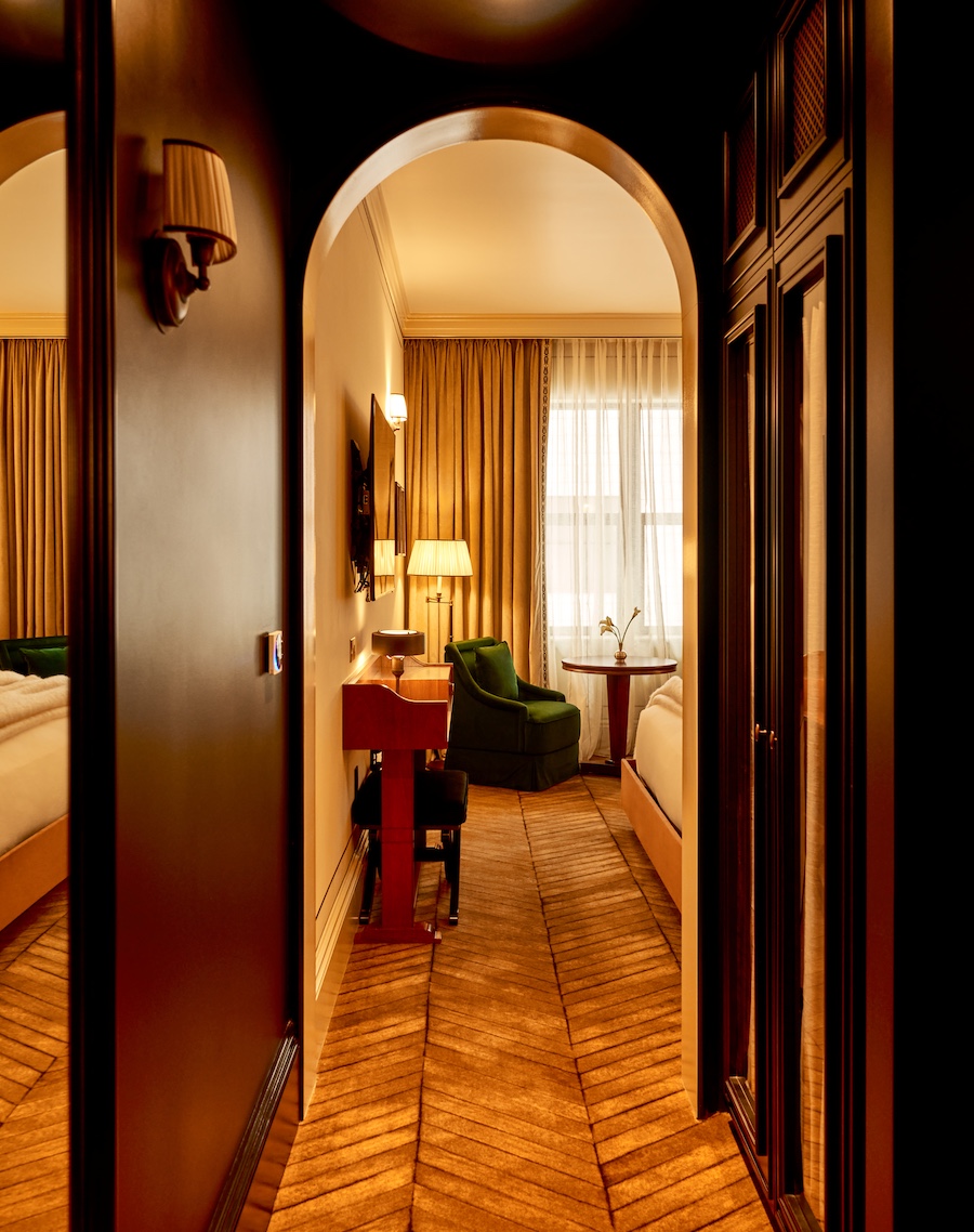 the twenty two new york guestroom corridor chevron flooring arched doorway