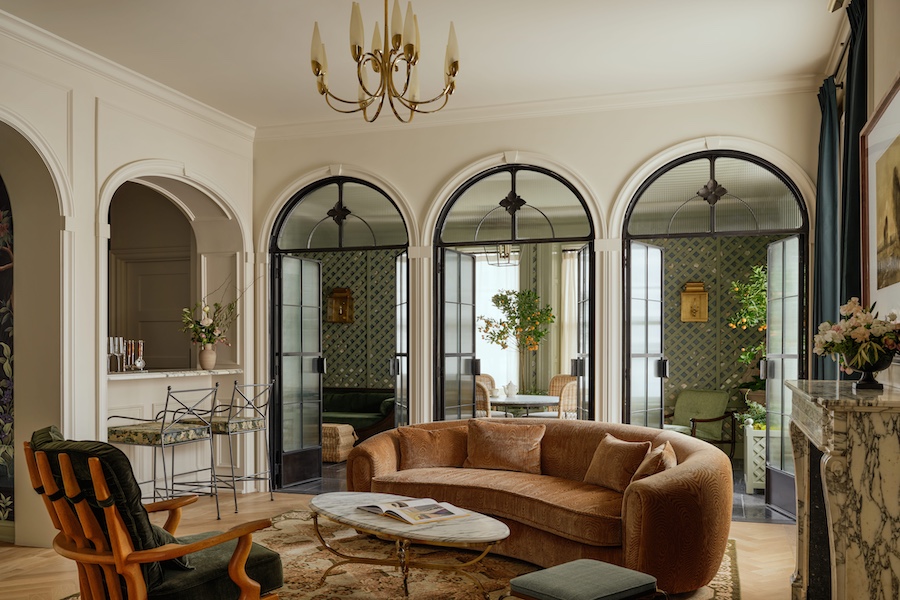 the bellevue hotel philadelphia Unbound Collection by Hyatt renovation presidential suite living room arched glass doorway brown sofa