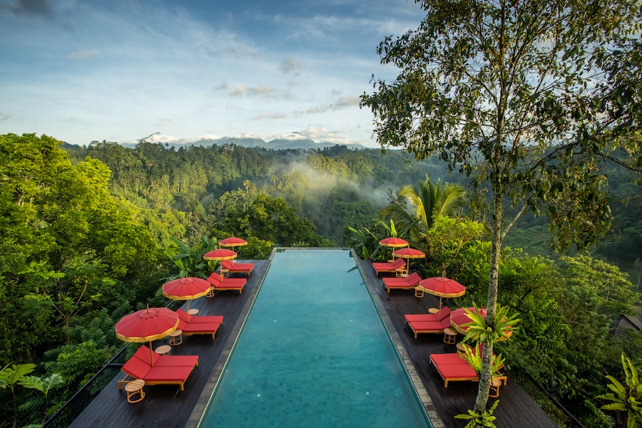 Buahan, a Banyan Tree Escape bali open air design no walls no doors adults only resort jungle treehouse pool red loungers umbrellas
