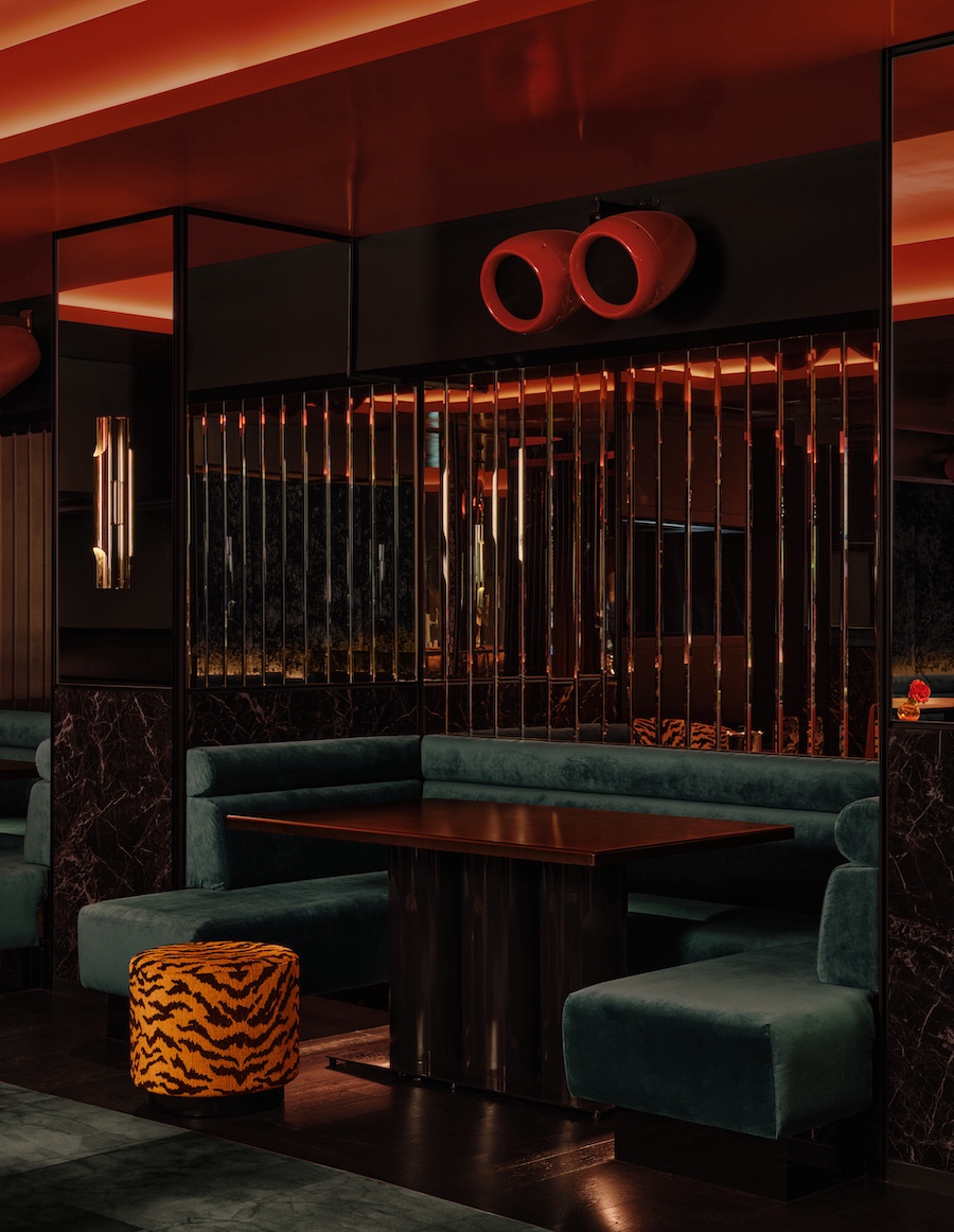 bowie supperclub speakeasy style old montreal 1980s glamour retro nightlife leopard print green banquette red speakers reflective mirrored walls