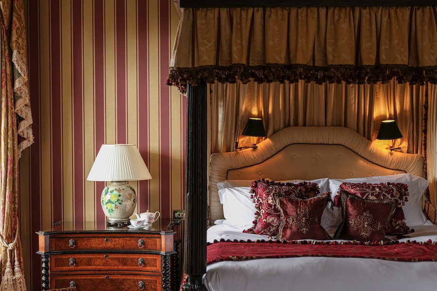 Lucknam Park Hotel & Spa Accor Emblems Collection english countryside estate historic design bedroom bed striped wallpaper red gold table lamp