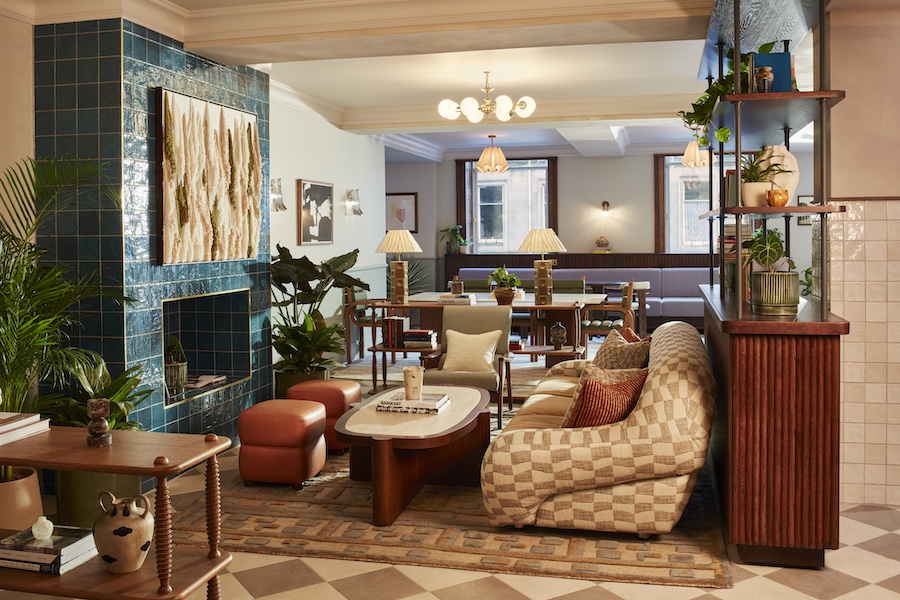 The Hoxton Edinburgh Lobby seating area checkered sofa blue teal fireplace tile