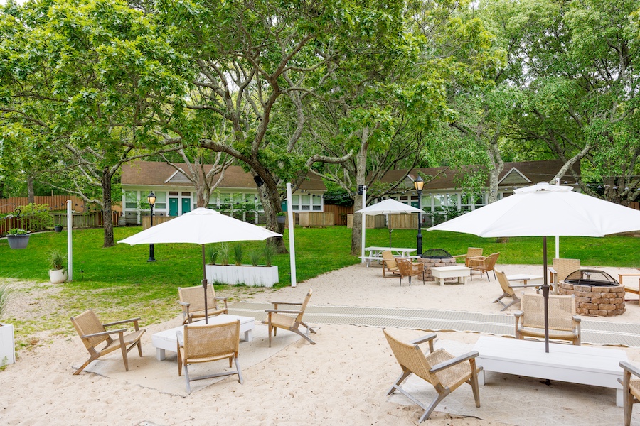 Ruschmeyer’s montauk long island new york summer camp lodging coastal outdoor seating white umbrella