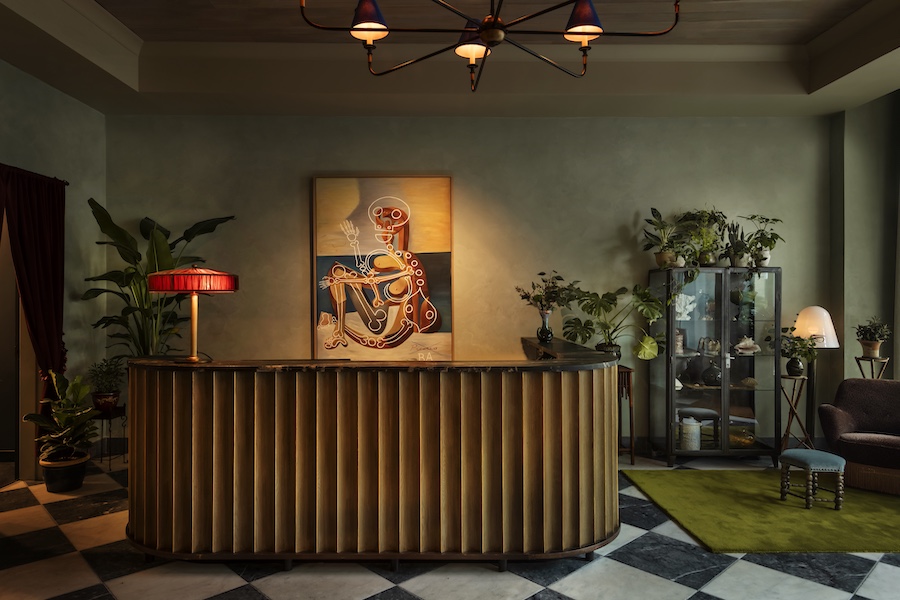 the nickel hotel charleston south carolina king street southern townhouse design lobby black white checkered flooring reception desk art