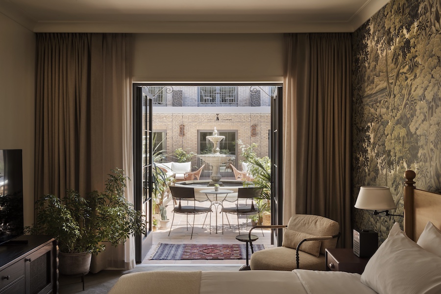 the nickel hotel charleston south carolina king street southern townhouse design floral landscape sepia wallpaper guestroom bed courtyard views
