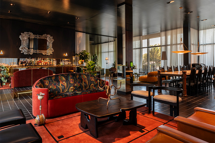 the radical hotel asheville north carolina river arts district afterglow restaurant gold chains around racetrack bar