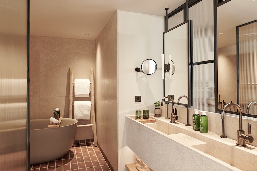 1 Hotel Copenhagen bathroom black framed mirror square tile floor free standing tub double sink vanity