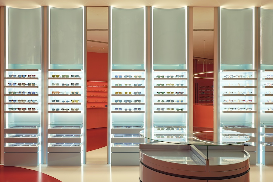 elias optics retail spain eyeglass store visual auditory health orange red glasses display
