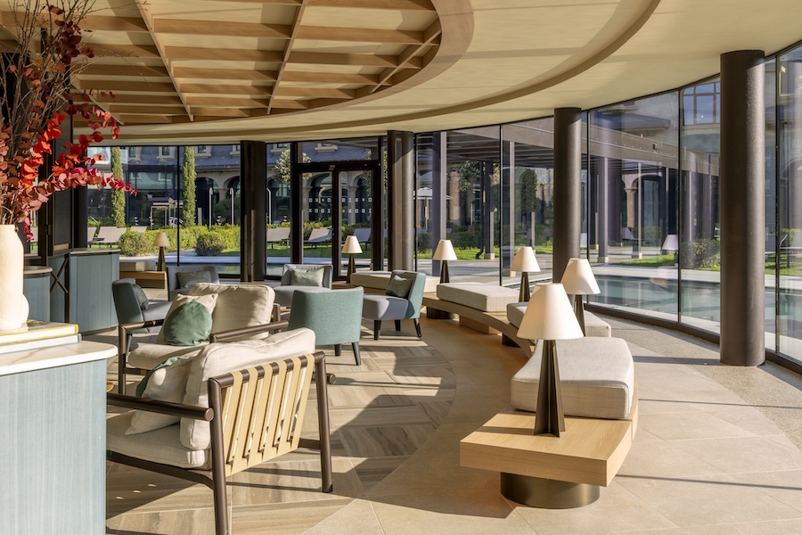 De Montel Terme Milano urban thermal spa milan italy former horse stable Scuderie De Montel internal courtyard chairs curved glass
