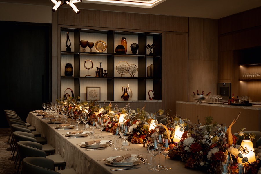 rosewood doha salon dinner private dining communal table flowers centerpiece table settings