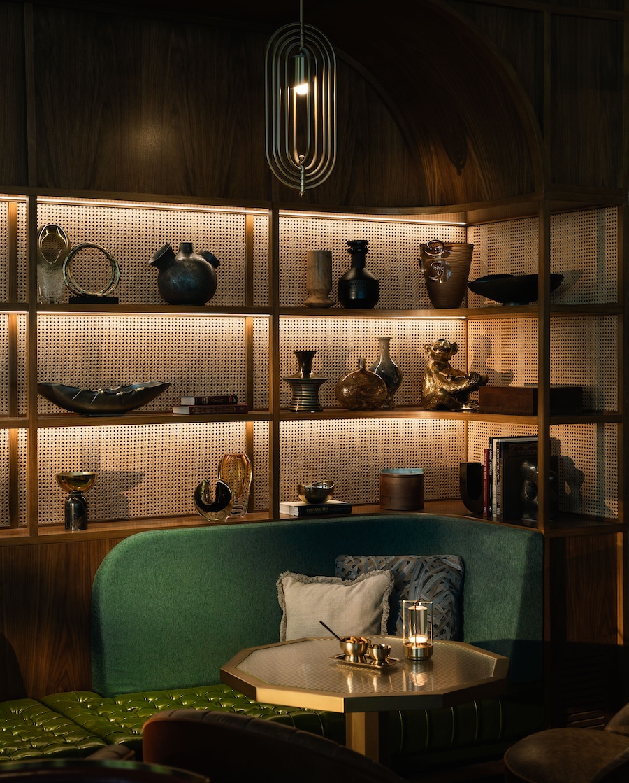 rosewood doha stoke & stoker restaurant top lit shelves ceramics green banquette octagon table