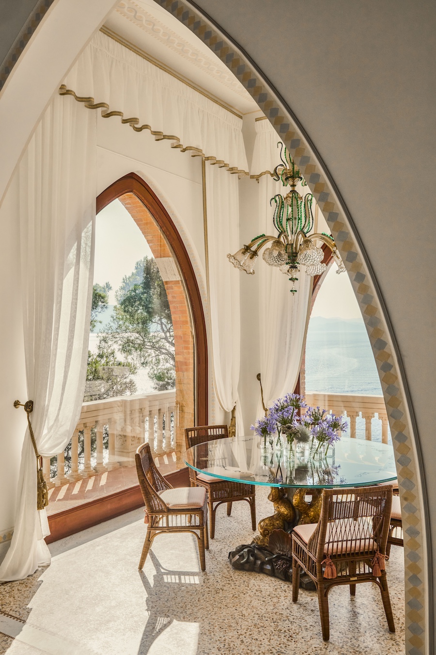 villa beatrice luguria italy italian dolce vita clifftop estate suites arch doorways windows balcony glass chandelier round table