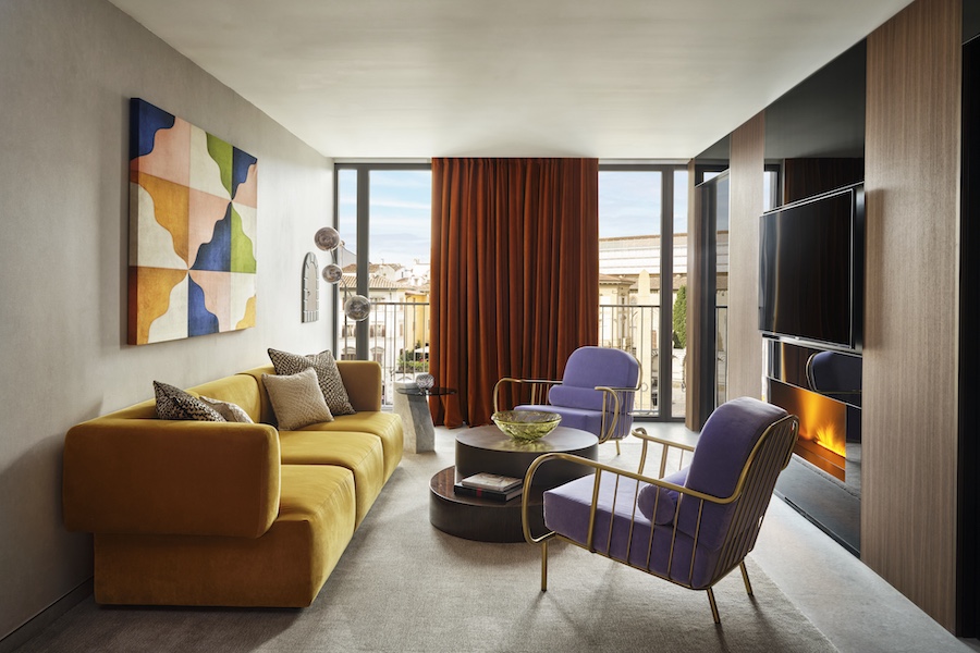w florence supreme suite orange curtains purple chairs yellow sofa couch colorful wall art