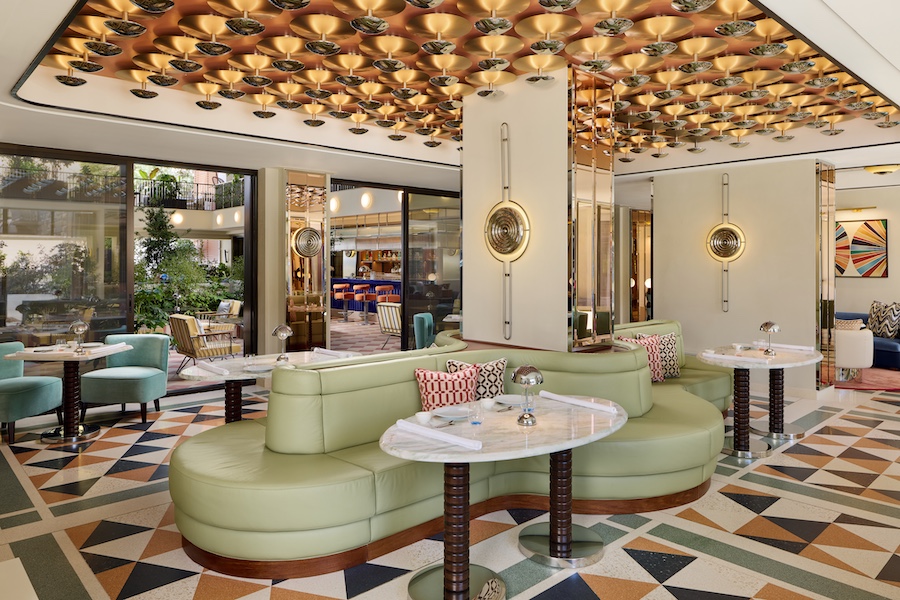w florence tratto restaurant gold sculptural ceiling geometric floor curved green banquette