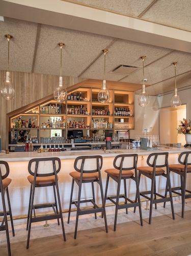 the kingsway new orleans Chef Ashwin Vilkhu singapore restaurant bright natural light oak white bar stools