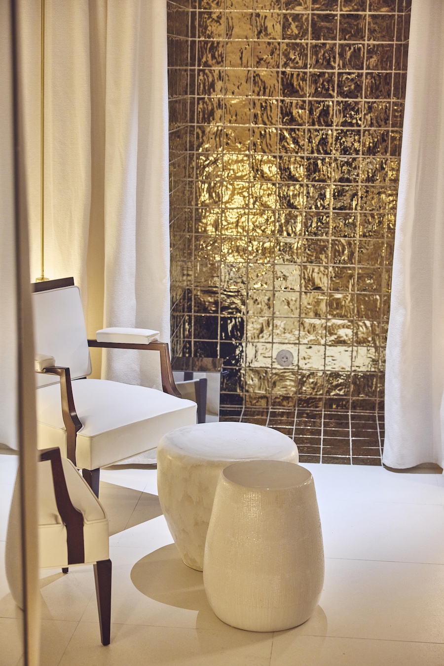 brach madrid Philippe Starck hotel la capsule wellness center white chair gold wall tiles