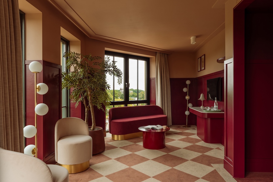 Efteling Grand Hotel the netherlands theme park guestroom red paint sofa checkered floors indoor plant