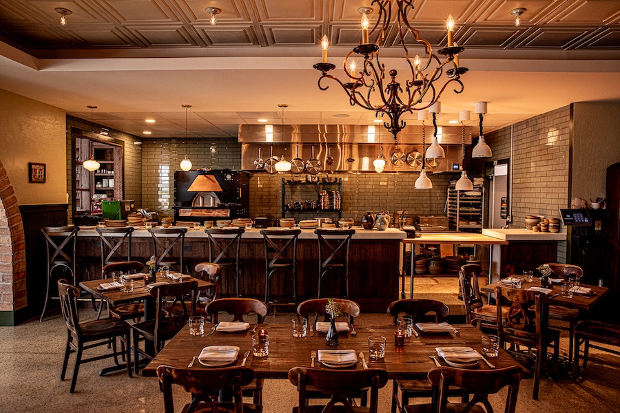 Cane Pazzo charleston south carolina italian osteria main dining room coffered ceiling chandelier open kitchen