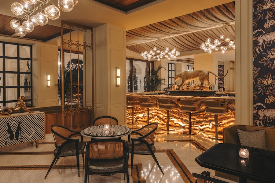 Fairmont Udaipur Palace Dahaad - The Palace Bar sputnik chandeliers leopard statue bar stools cane weave bistro chairs