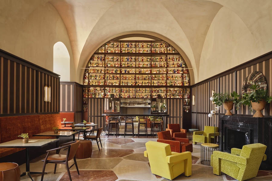 Vista Ostuni puglia italy 14th century palazzo vaulted ceilings chiostro bar liquor shelf palladian floors orange baquettes yellow chair