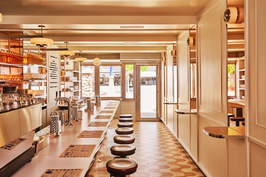 dreamboat san diego cafe desserts sweets bright airy light vertical white tiles orange white patterned flooring bar stools