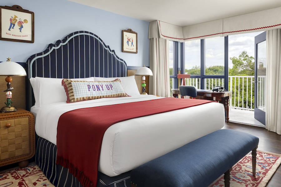 graduate dallas Southern Methodist University texas king suite guestroom pinstripe blue white headboard