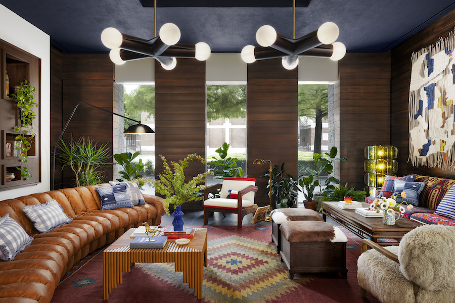 graduate dallas Southern Methodist University texas lobby wall art leather couch indoor plants blue ceiling