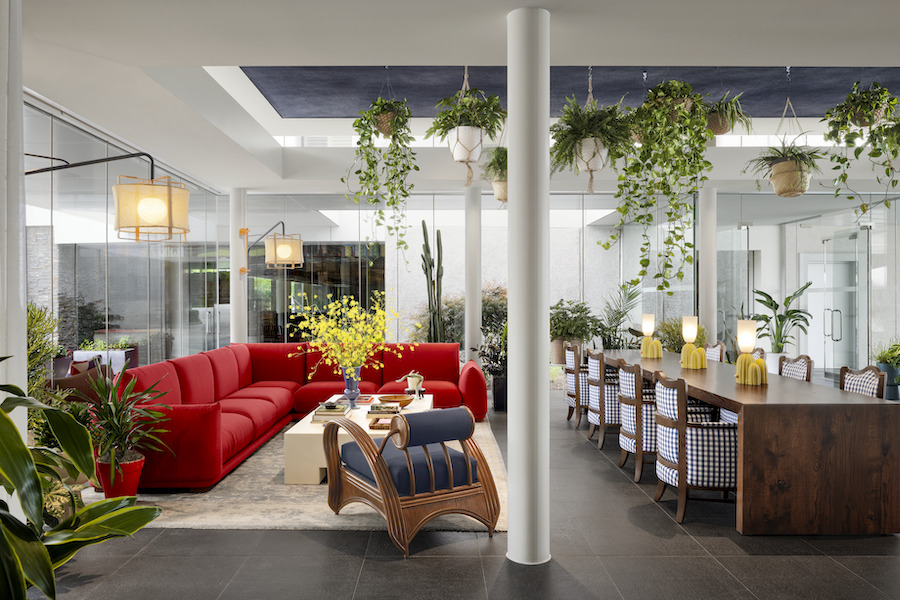 graduate dallas Southern Methodist University texas lobby hanging plants red couch communal table plaid chairs