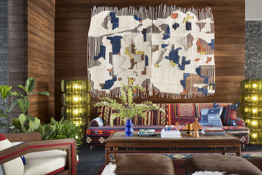 graduate dallas Southern Methodist University texas lobby patterned couch wall tapestry wood slat wall
