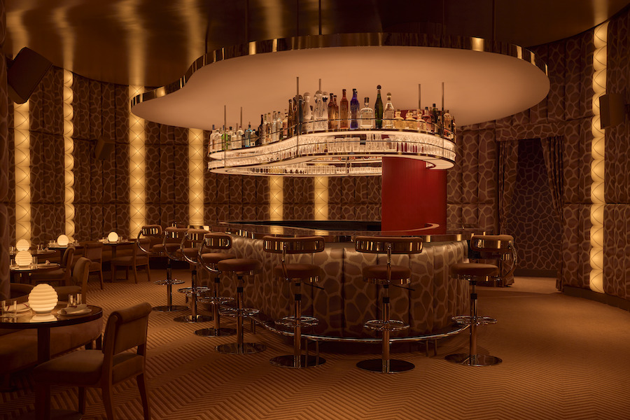 Obvio modern supper club cocktail bar Manhattan new york cinematic interiors padded walls giraffe print brocade vertical lights bar stools