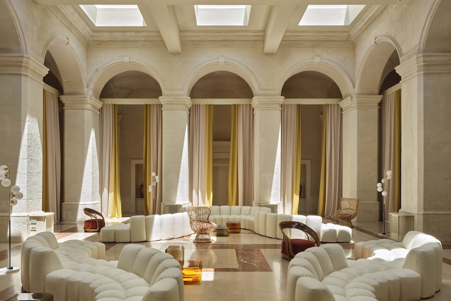 Vista Ostuni puglia italy 14th century palazzo vaulted ceilings arched doorways yellow curtains white sofas