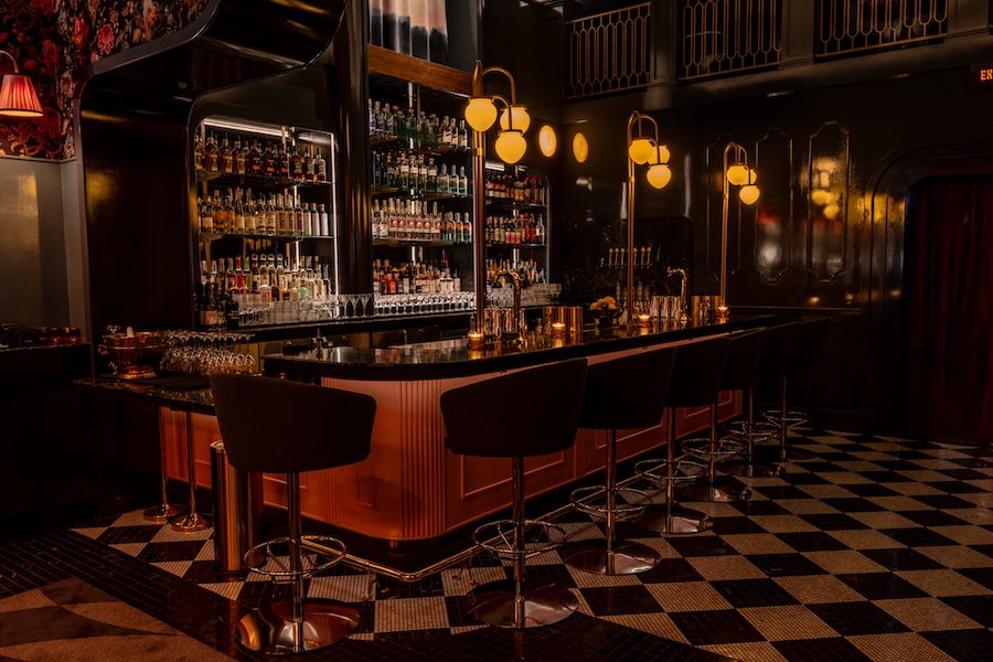 vulture san diego neoclassical moody restaurant black white checkered tile floor fluted wood bar