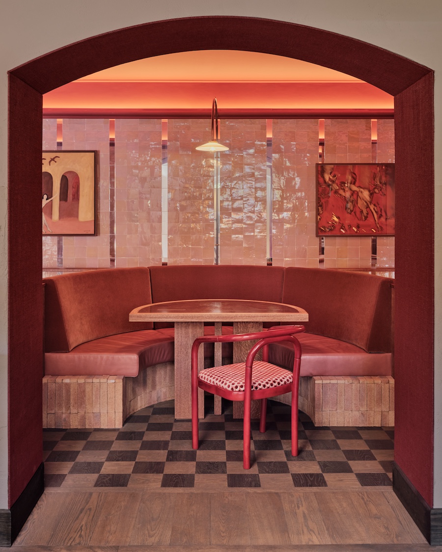 vertigo cafe Amsterdam Vondelpark Pavilion alfred hitchcock movie maining dining room red pink palette striped pattern bistro chairs arched doorways black and white checkerboard flooring