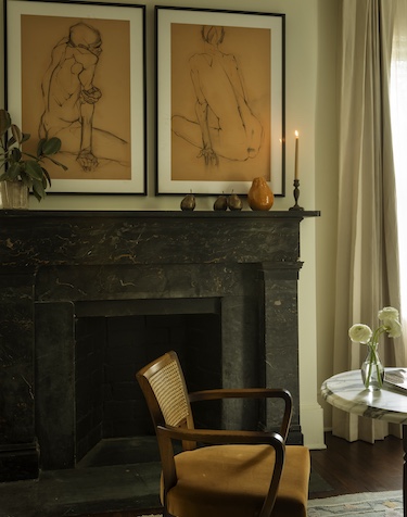 the douglas savannah georgia restored townhouse 1853 fireplace human sketches brown armchair rattan back