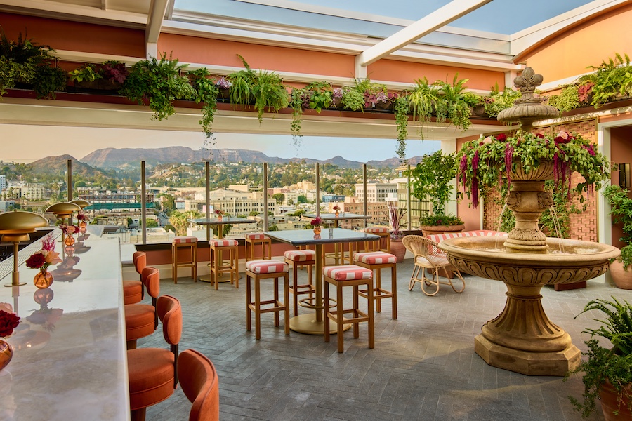 the hollywood grande los angeles former thompson hotel midcentury design bar lis indoor plants two tiered fountain mountain views bar stools