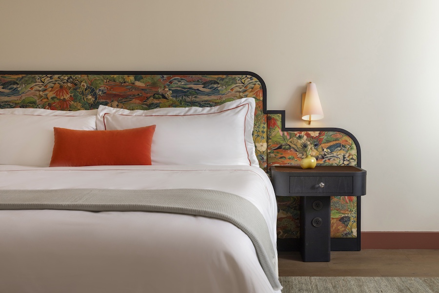 hotel daphne houston texas guestroom floral headboard orange pillow bed nightstand