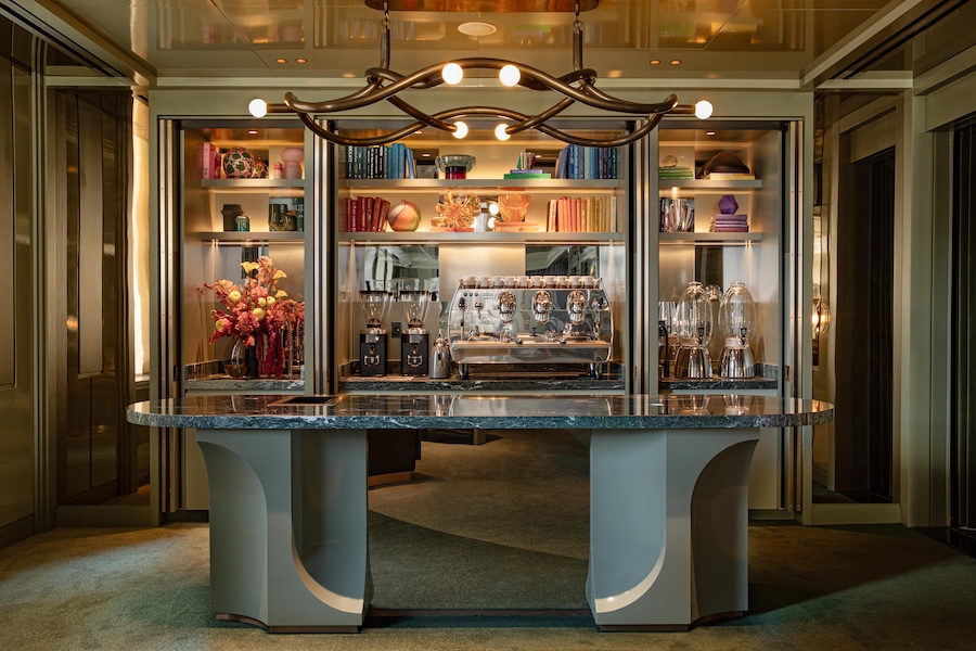 W New York – Union Square Living Room Coffee Bar marble table built in shelving brass sculptural chandelier