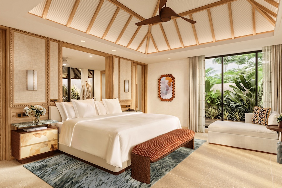 Four Seasons Resort Mauritius at Anahita guestroom bed exposed beams ceiling fan tropical plants