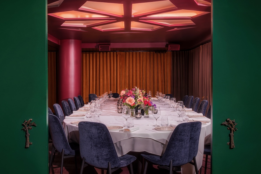 passerine bar new york manhattan flatiron indian restaurant jewel tones red wall paint column private dining room blue velvet chairs