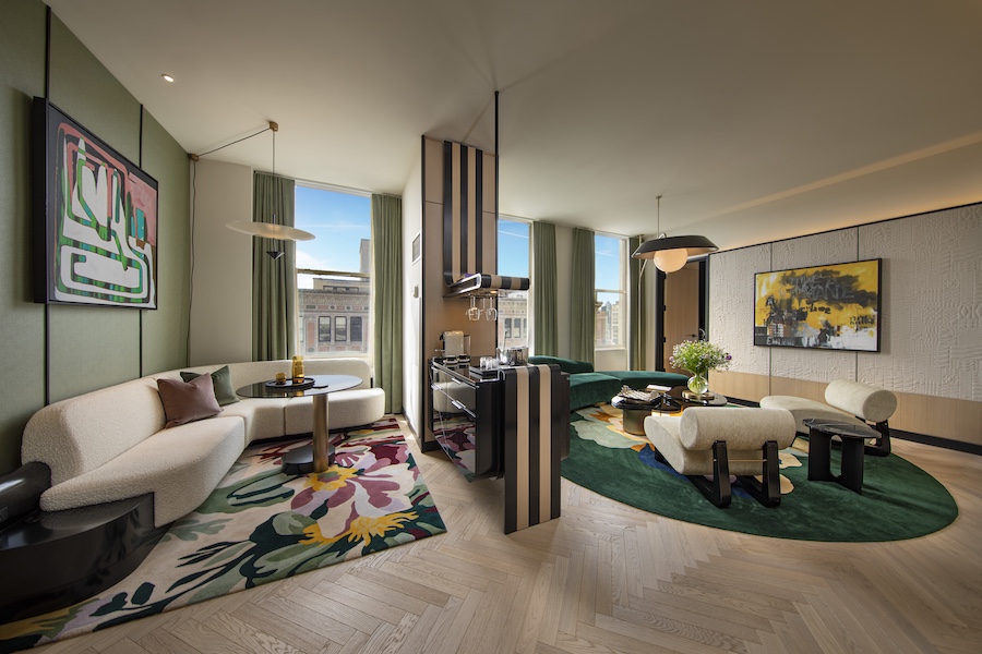 W New York – Union Square Penthouse Suite living room white sofa couch green rug wall art
