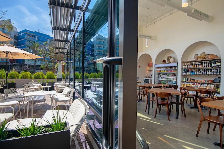 Stoa Wine Bar & Market marina del rey los angeles california curated goods arched niche shelving outdoor patio