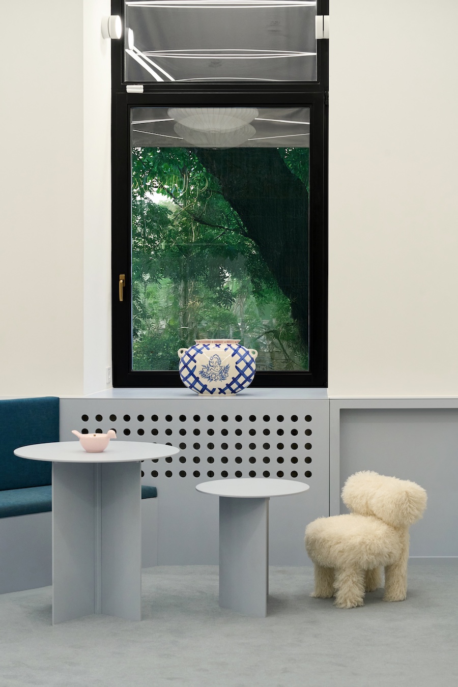 gunia project kyiv retail store lifestyle accessories ceramics ukrainian wood fuzzy white chair gray side tables window
