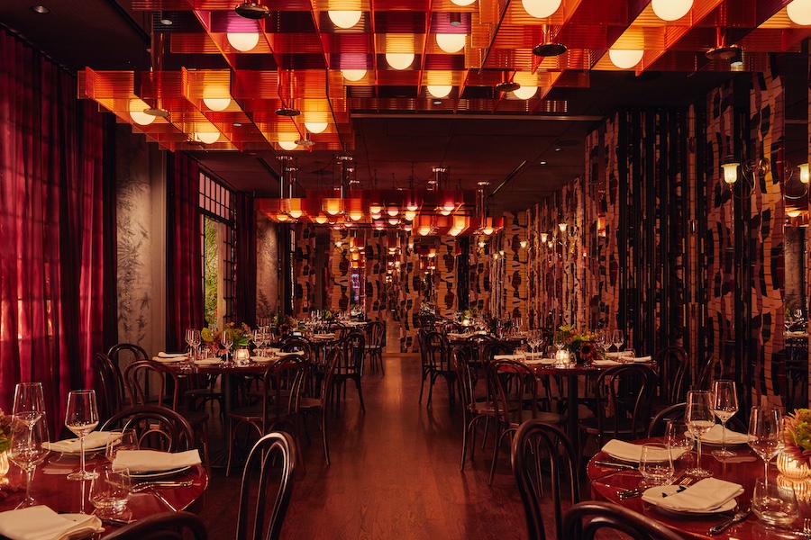 quality branded limusina new york midtown manhattan dramatic cinematic blade runner retro futurism red curtains amber ambe lights black and white tiles gold chandelier