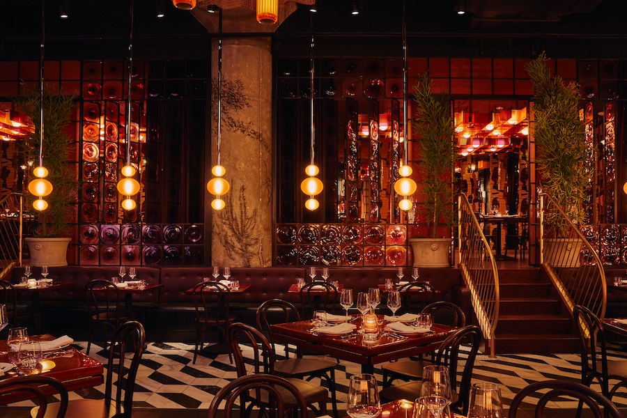 quality branded limusina new york midtown manhattan dramatic cinematic blade runner retro futurism red amber black and white tiles gold staircase