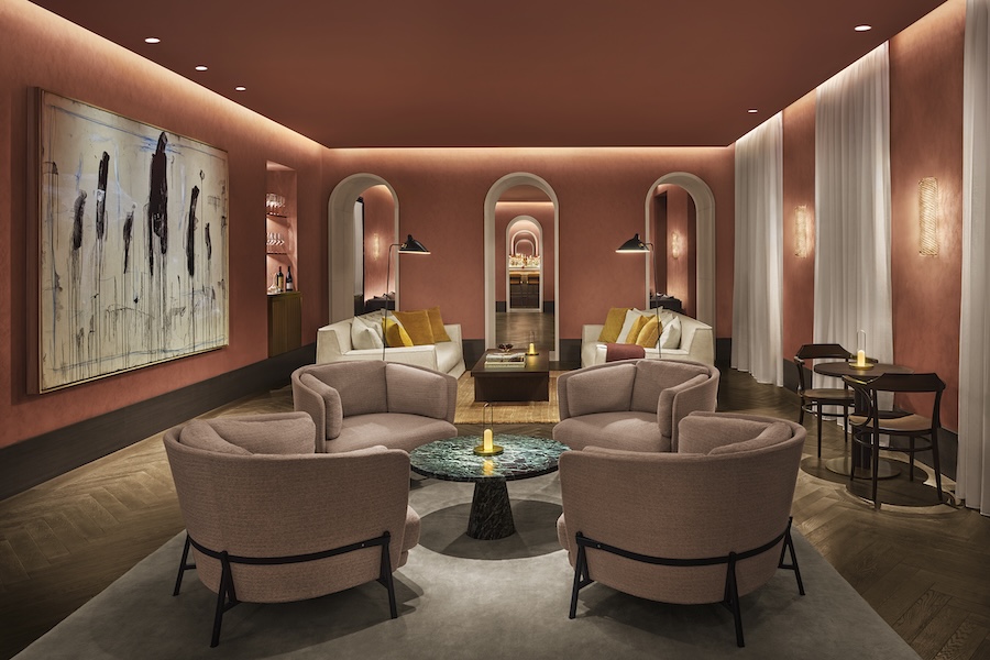 The Lake Como EDITION Cadenabbia Italy restored 19th century palazzo neri&hu de.tales seating lounge pink blush armchairs green marble tables orange terracotta walls arched doorways