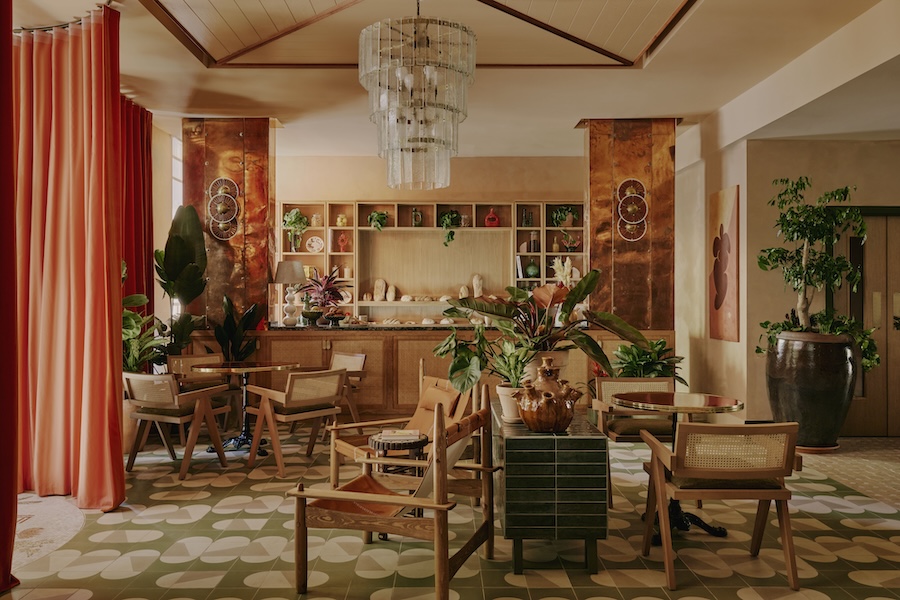 ember locke hotel west london kensington art deco colorful indoor plants patterned floor copper accents rattan chairs