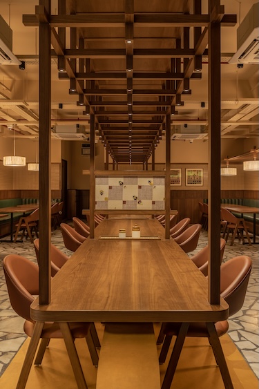 grid pavilion eat punjab communal dining bhopal india fluted wood piccolo tiles communal dining table grid light structure