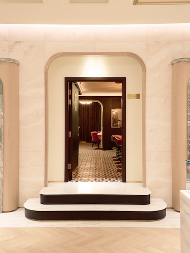 Ronnie's New York in London Regent street main dining room kith flagship entrance red velvet dining booth chairs